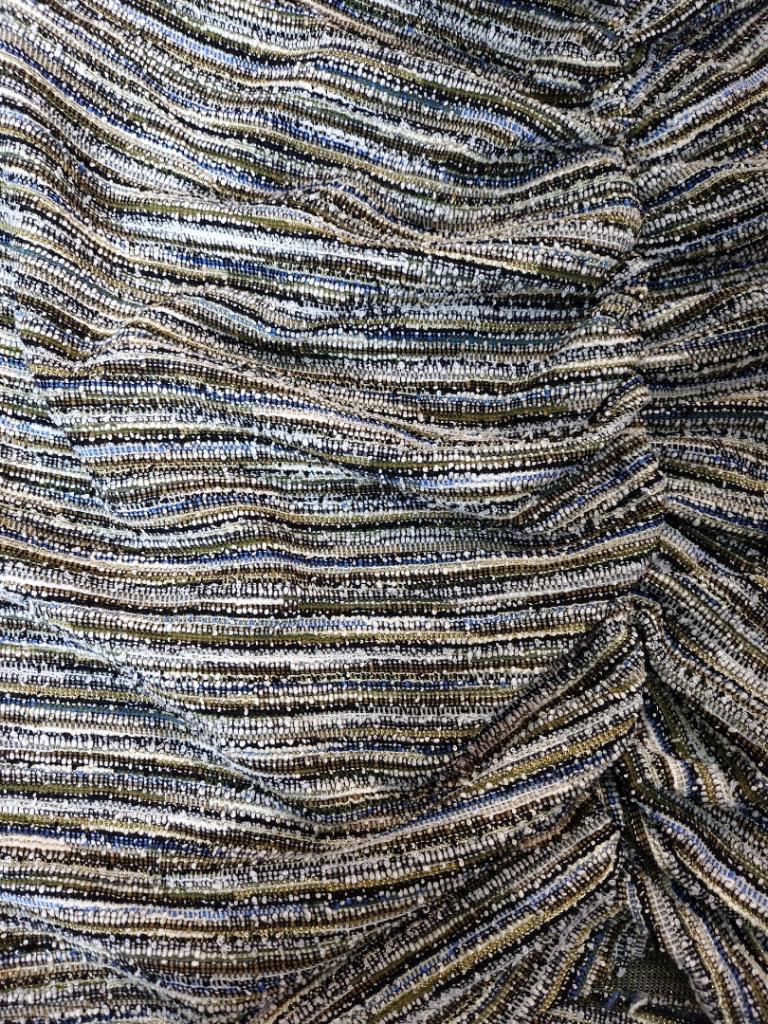 Closeup of the multi-colored mini skirt - olive blend.