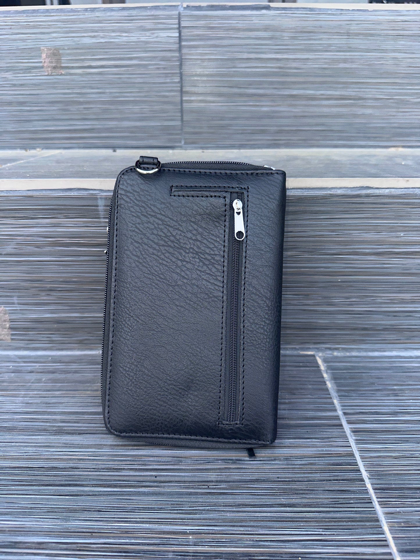 Mini crossbody bag with skull hardware, frills, and front phone pocket