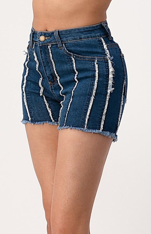 Alt front closeup of the denim shorts. The shorts display a vertically striped distress pattern.